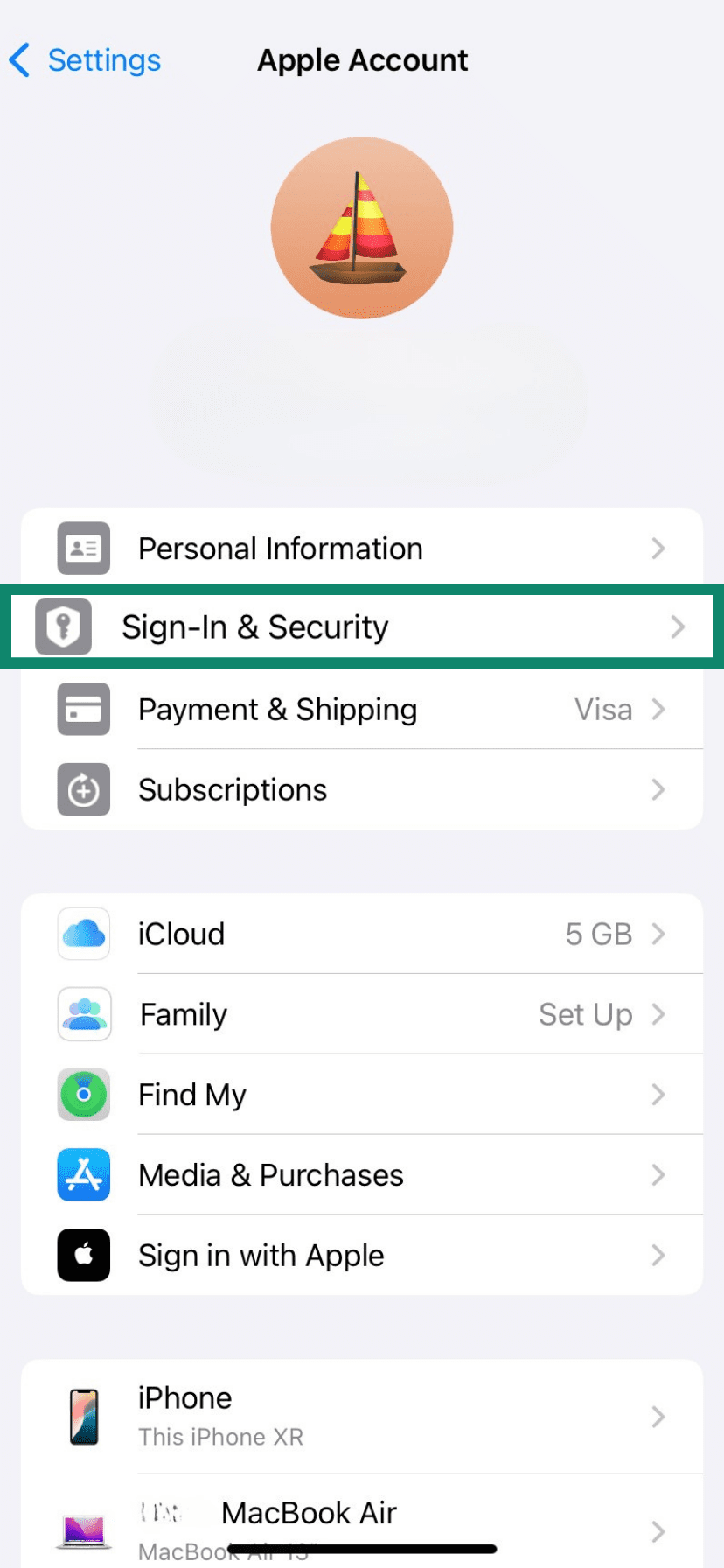 Apple Account settings with “Sign‑In & Security” highlighted; next step to open login and security options.